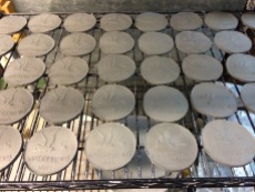 The coasters drying before going in the kiln